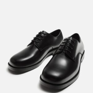 CHAUSSURES EN CUIR HABILLÉES