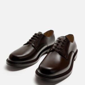 CHAUSSURES EN CUIR HABILLÉES